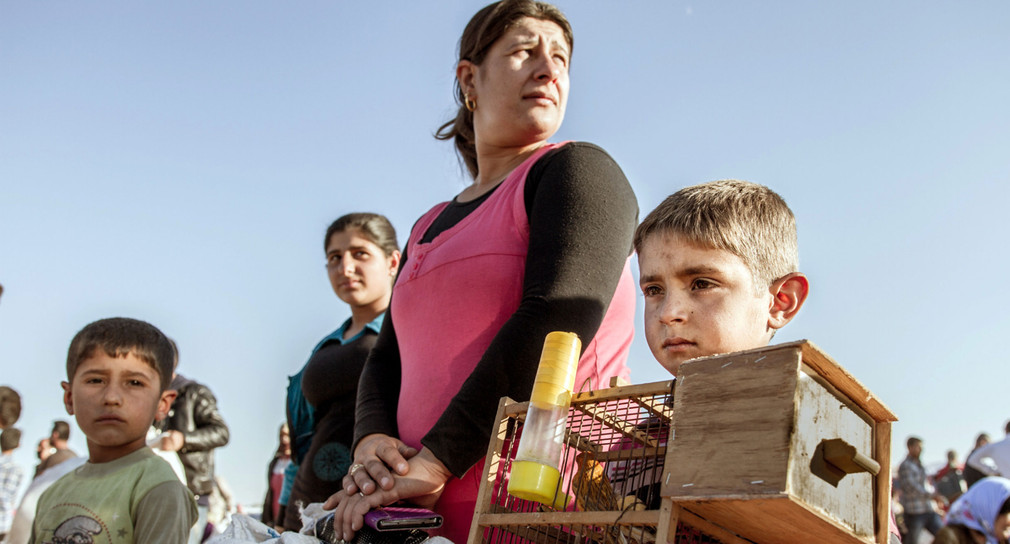 Einwohner der syrischen Stadt Kobani flüchten vor den Attacken Terrormiliz Islamischer Staat (Bild: © dpa).