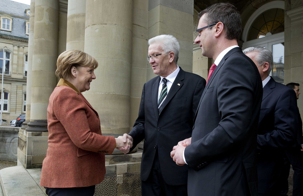 Bundeskanzlerin Angela Merkel (l.), Ministerpräsident Winfried Kretschmann (M.) und der Rottenburger Oberbürgermeister Stephan Neher (r.)